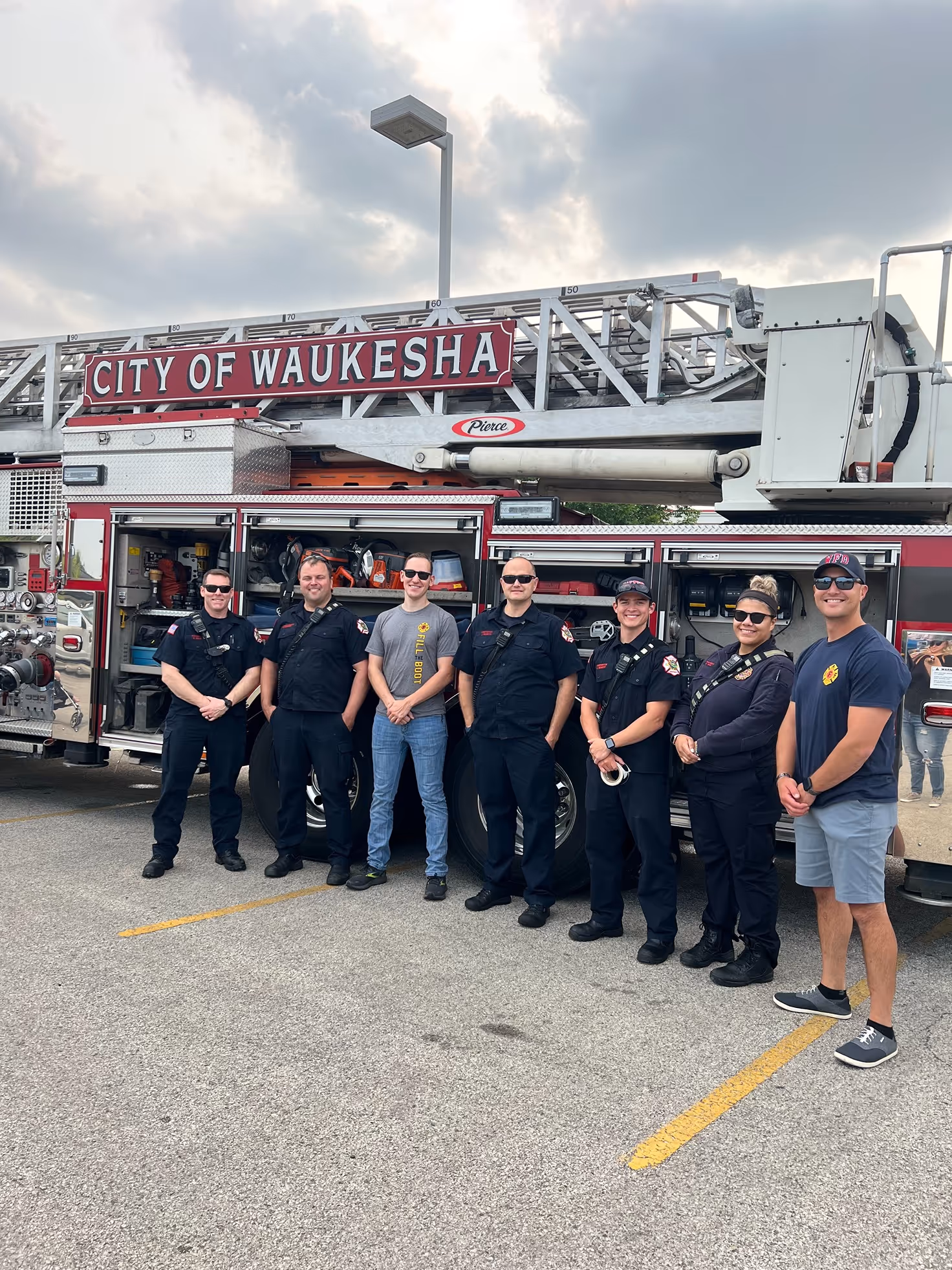 Waukesha fire fighters standing in front of fire engine