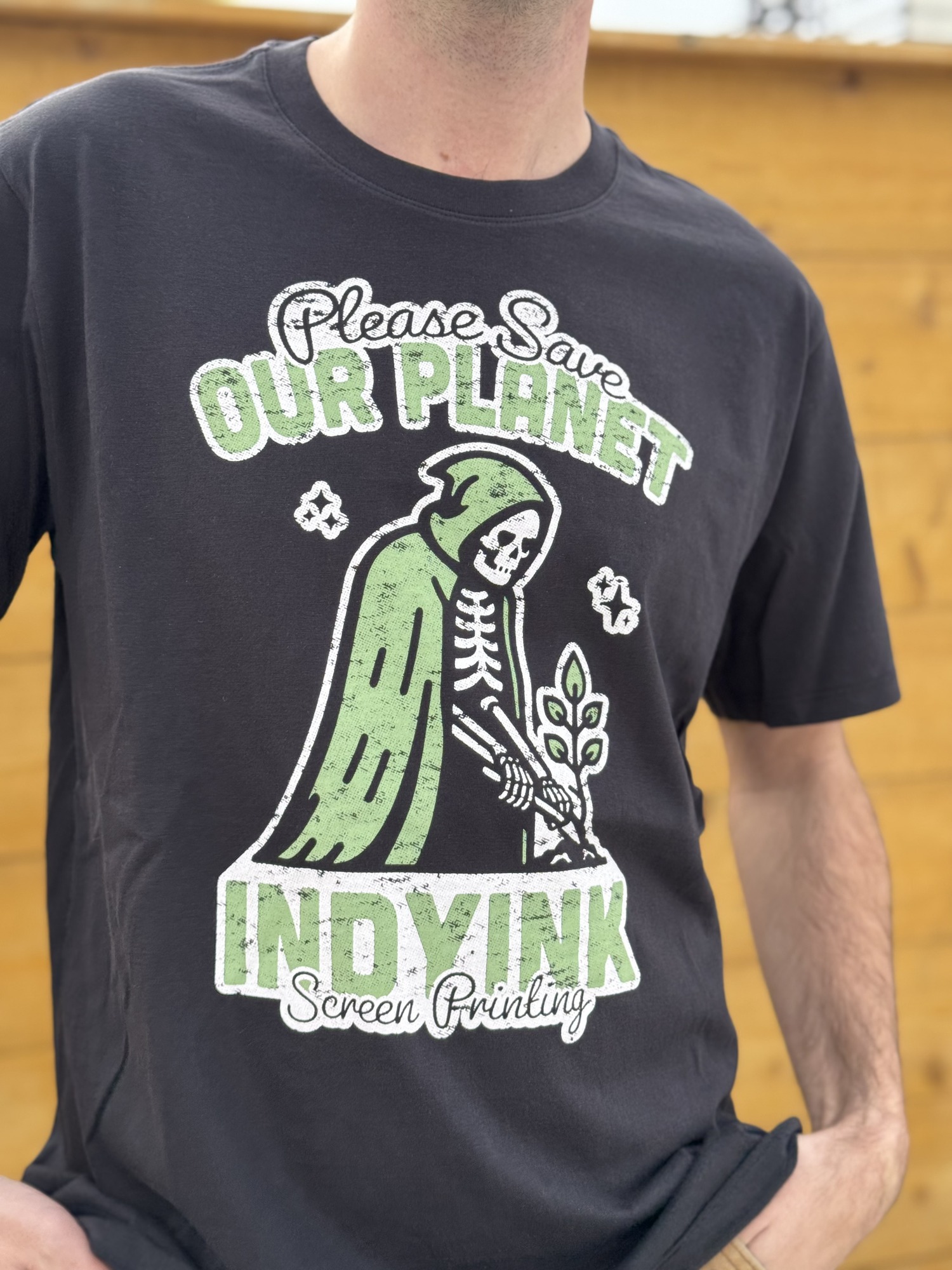 IndyInk Save Our Planet Tee - green grim reaper eco design on black blank