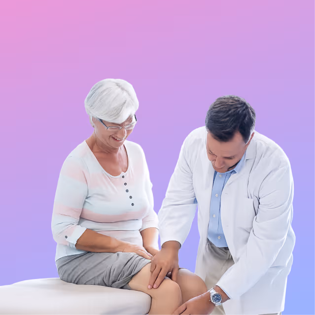 Doctor examining an elderly woman’s knee.