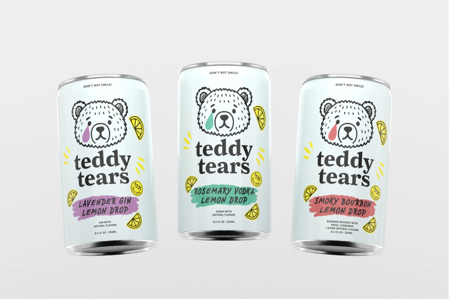 Three Teddy Tears cocktail cans lined up, featuring Lavender Gin Lemon Drop, Rosemary Vodka Lemon Drop, and Smoky Bourbon Lemon Drop flavors with illustrated bear mascot and lemon accents.