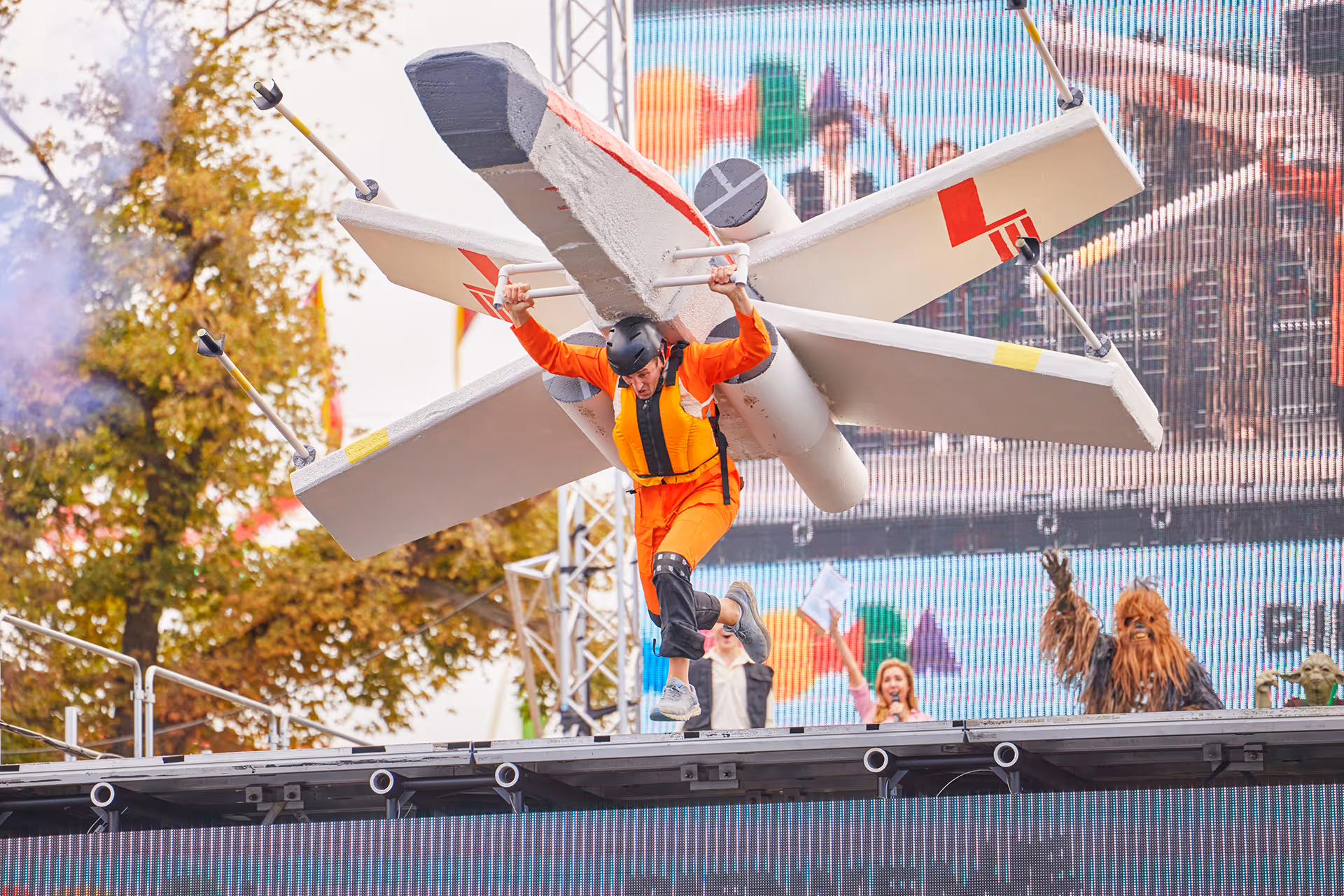 A man standing on top of a white plane.