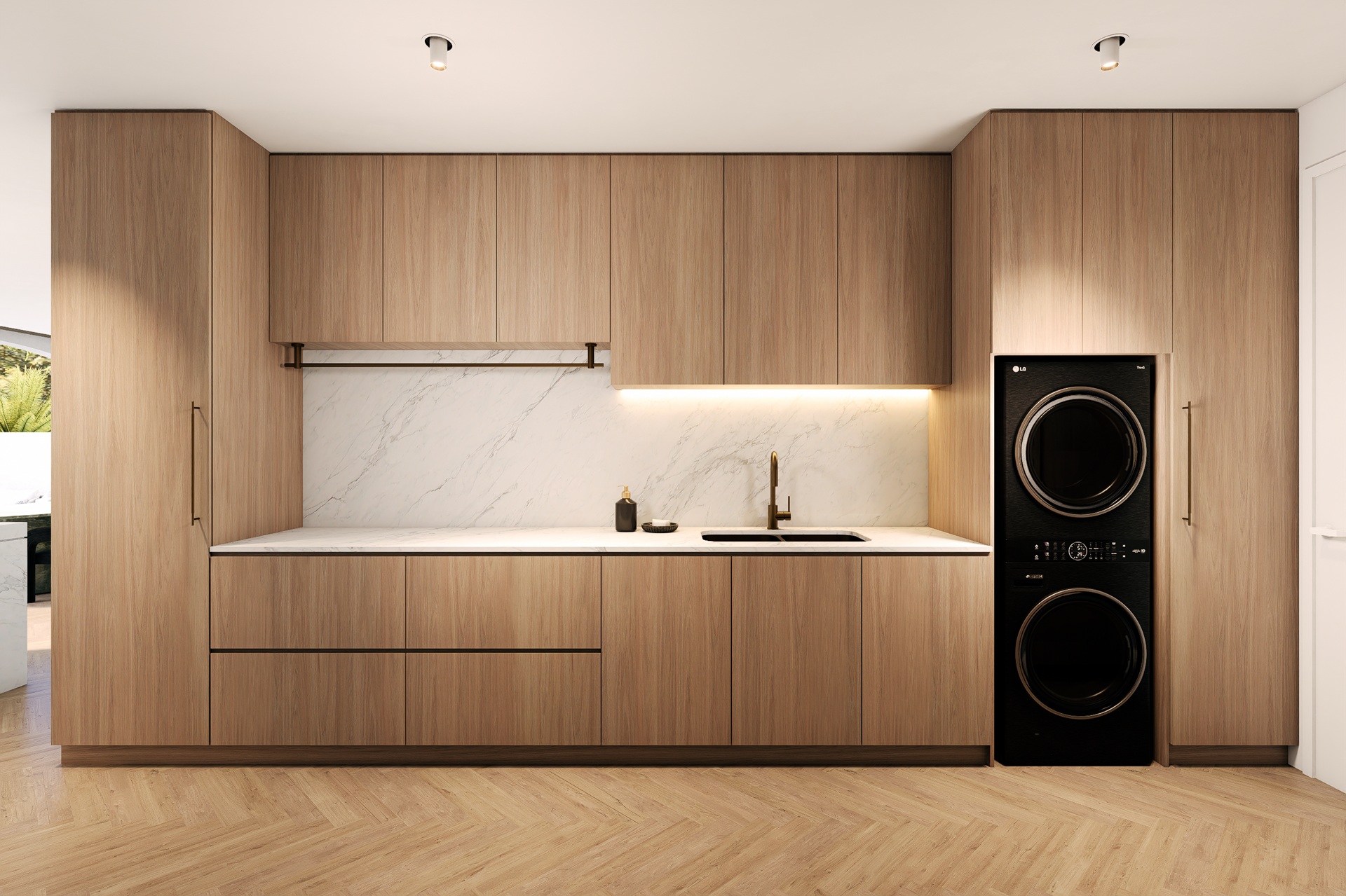 A kitchen with a washer and dryer in it.