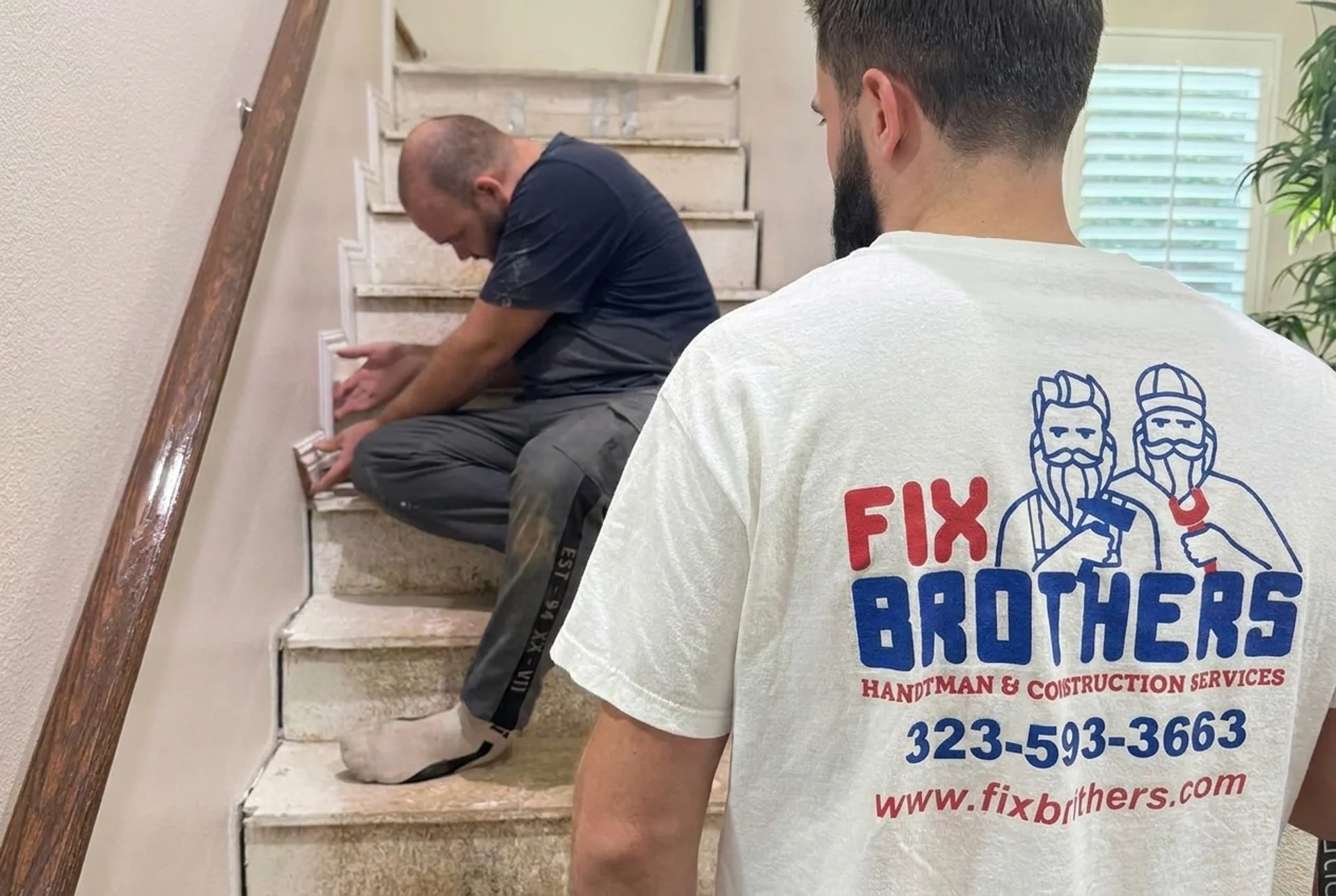 Fix Brothers handyman crew replacing tile on interior stairs in a Los Angeles home
