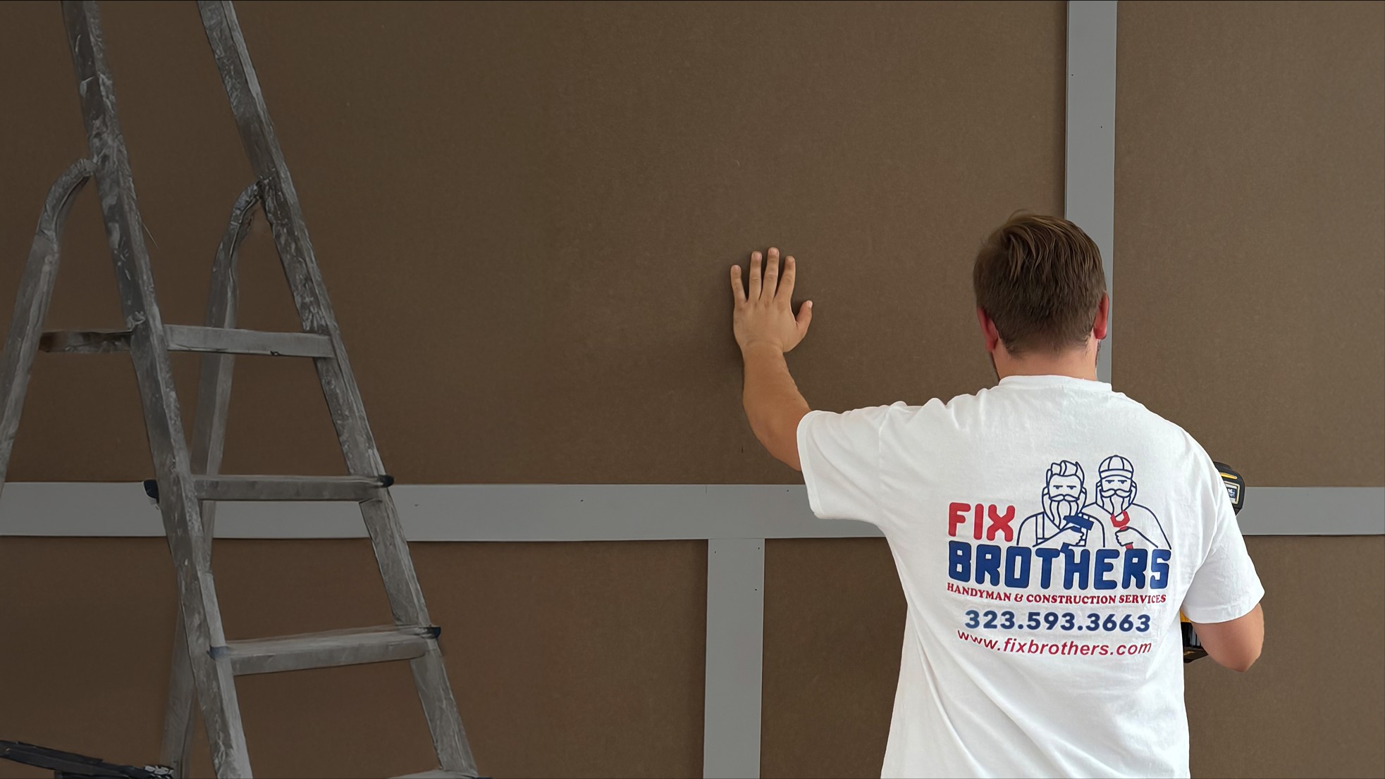 Fix Brothers crew installing wall panels over metal framing in Los Angeles