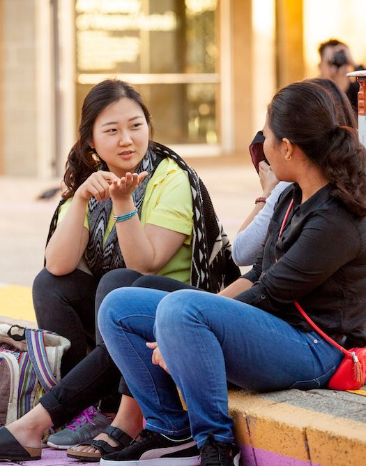 Frontiers Ministry member connecting through meaningful conversation with an international student in Perth.