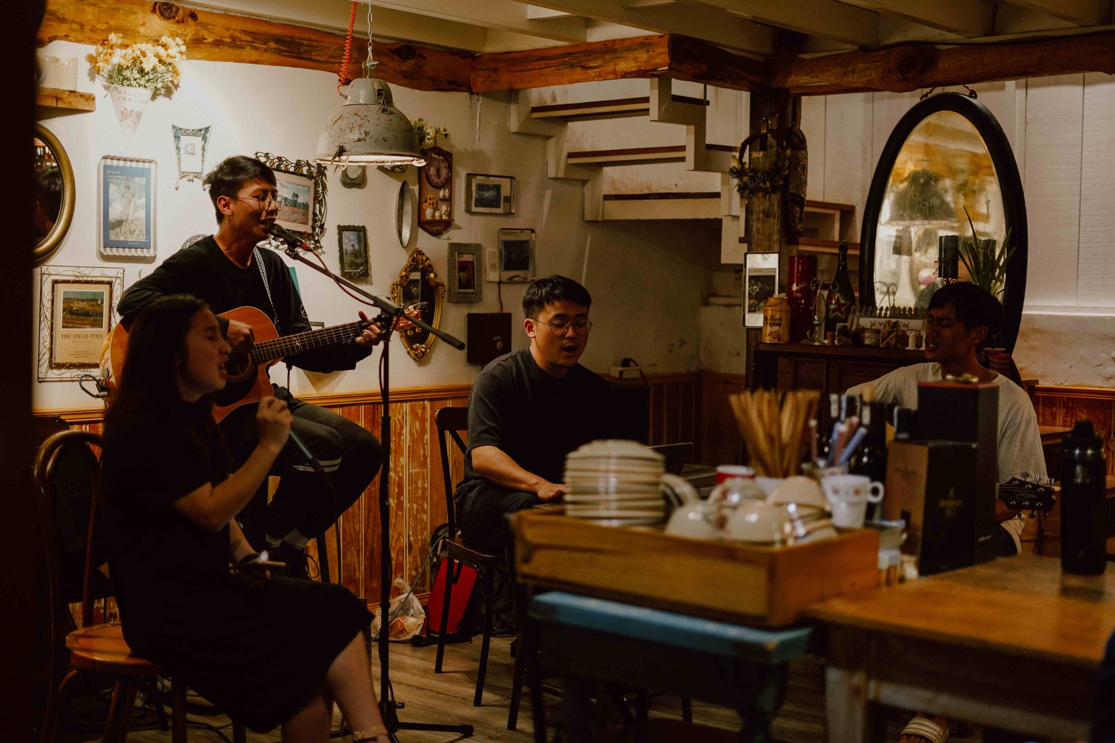 a group of people play music in a venue