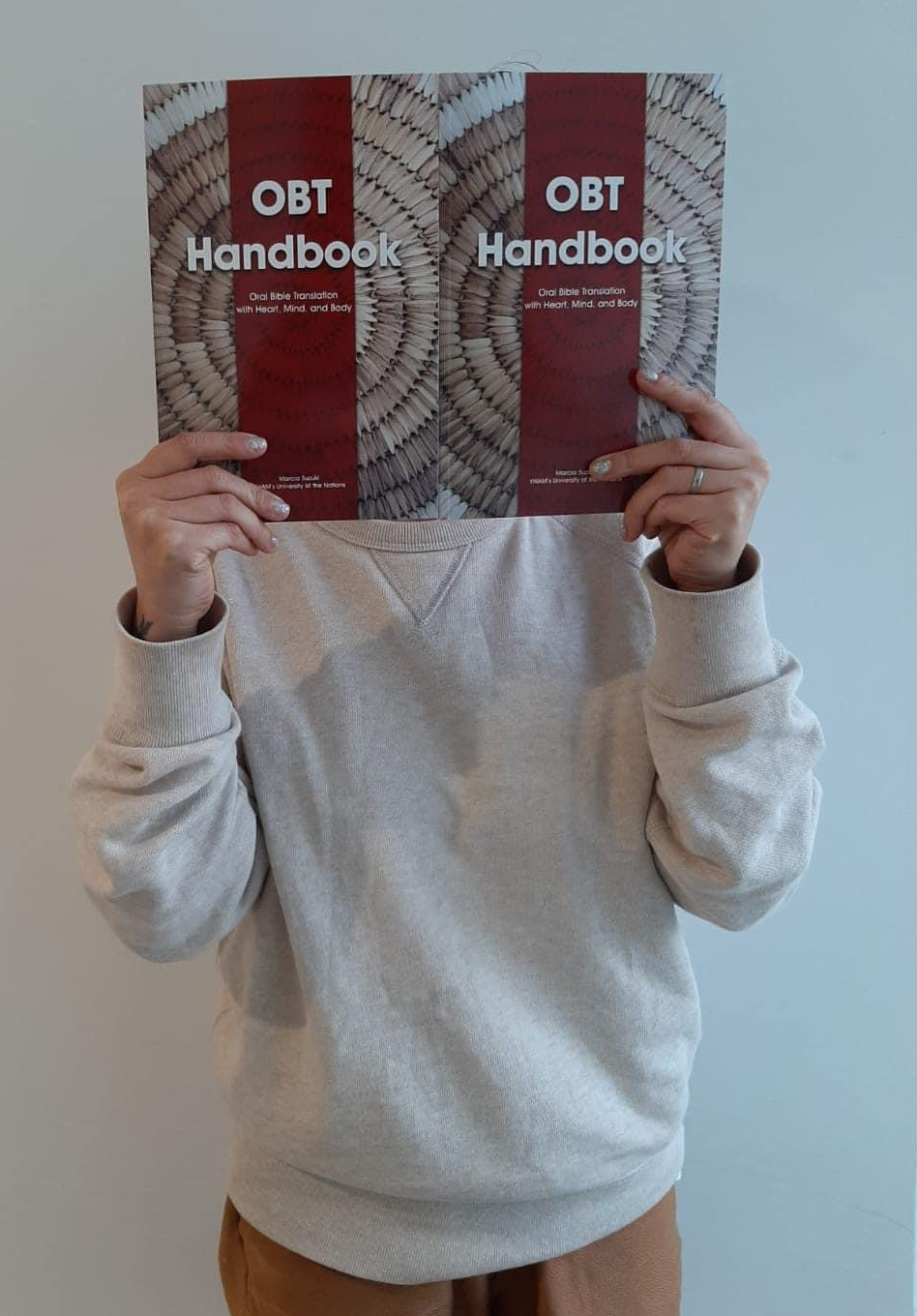 a person holds a translation handbook