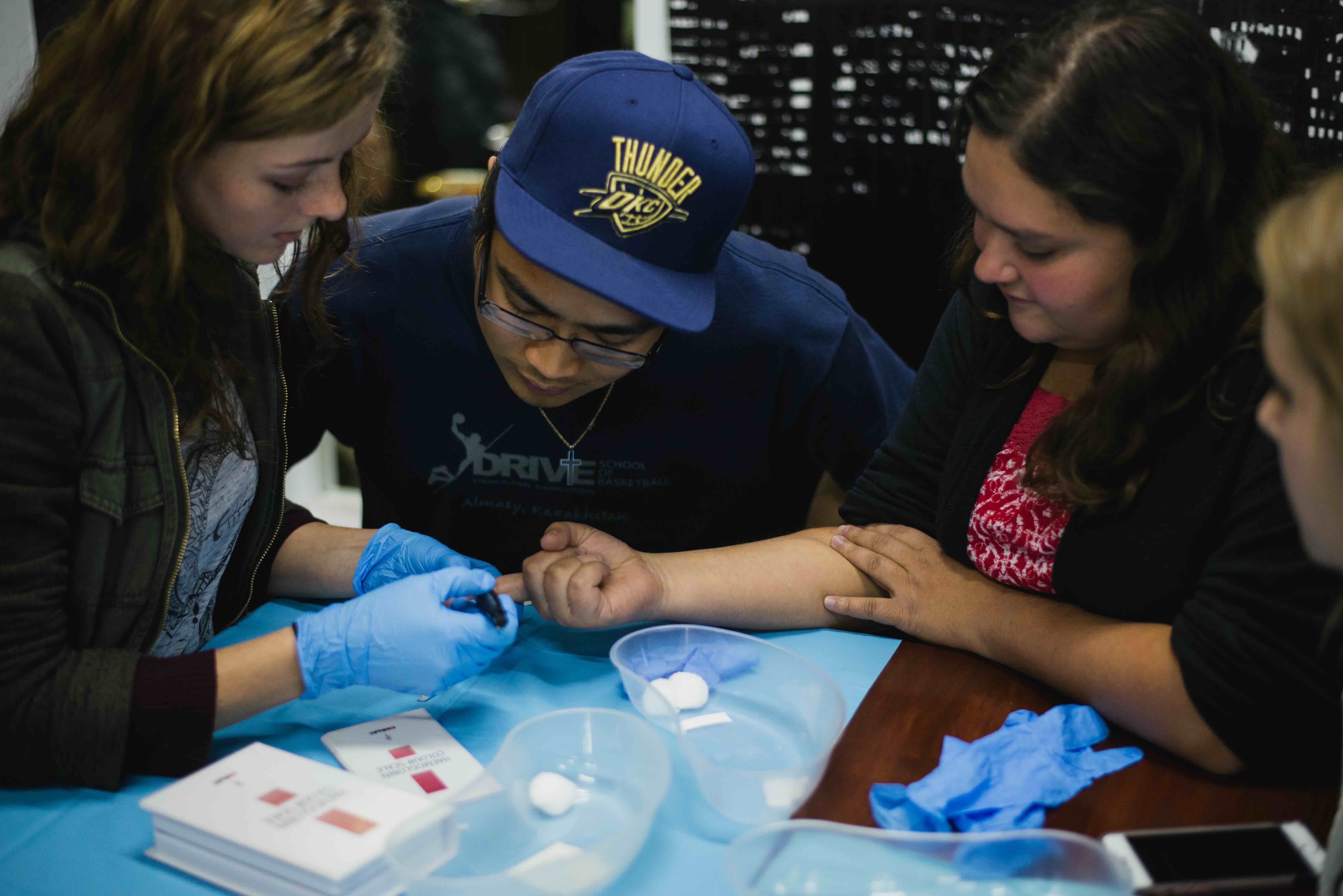 students practice health care skills