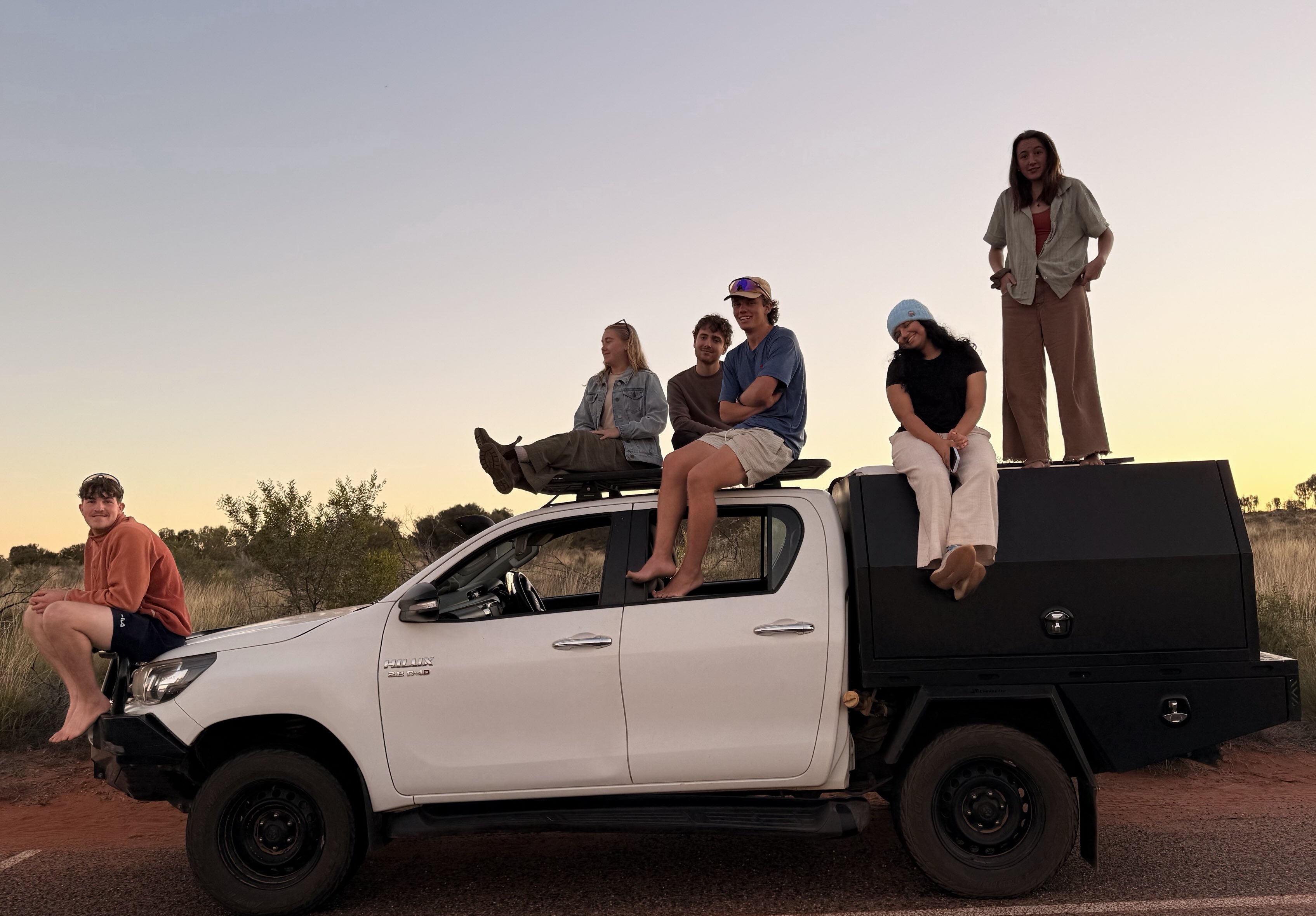 happy young people on top of a 4wd