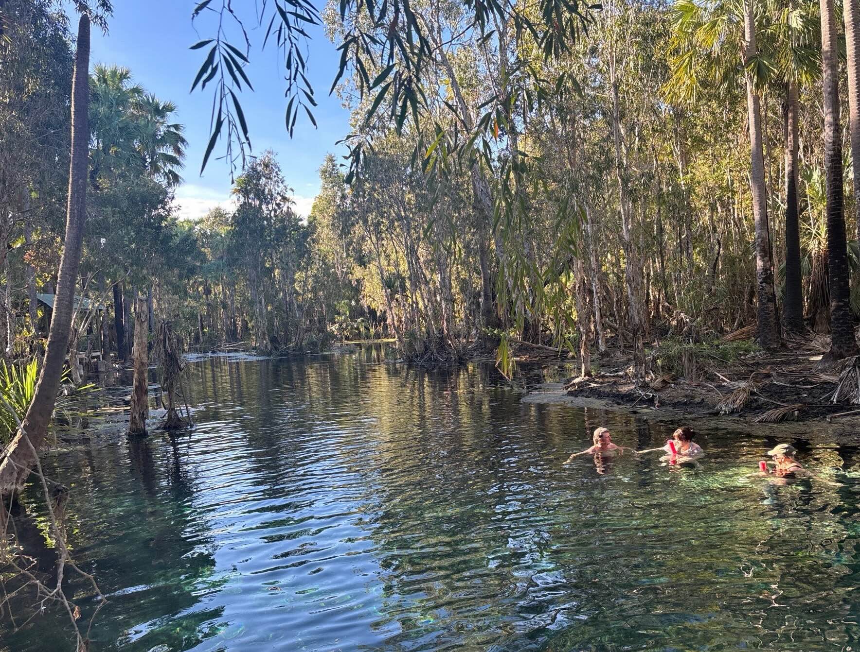 people swim in an outback spring