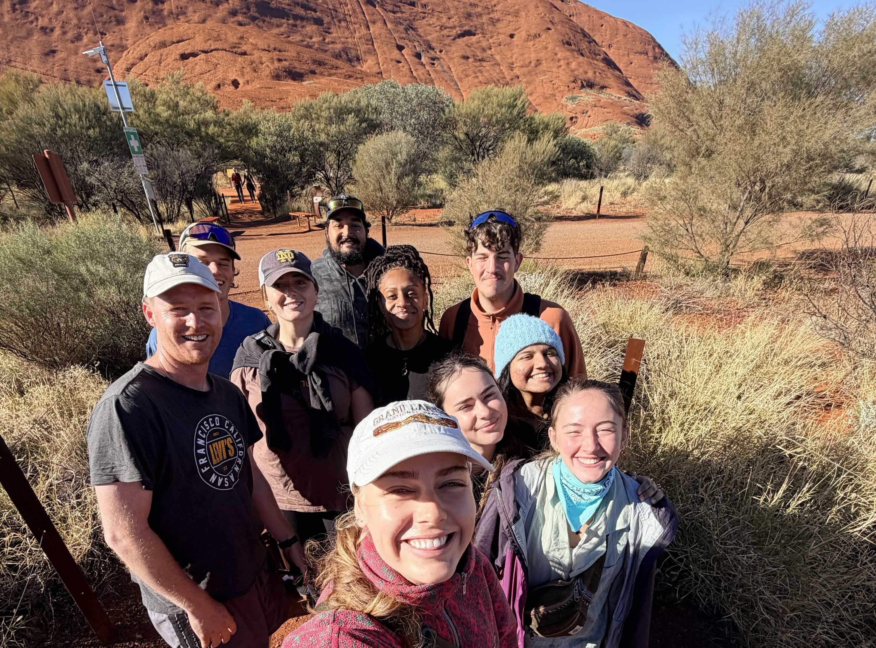 a group of young adults in the outback