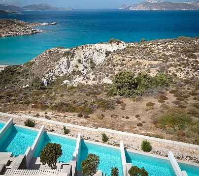A pool of clear water adjacent to a larger body of water