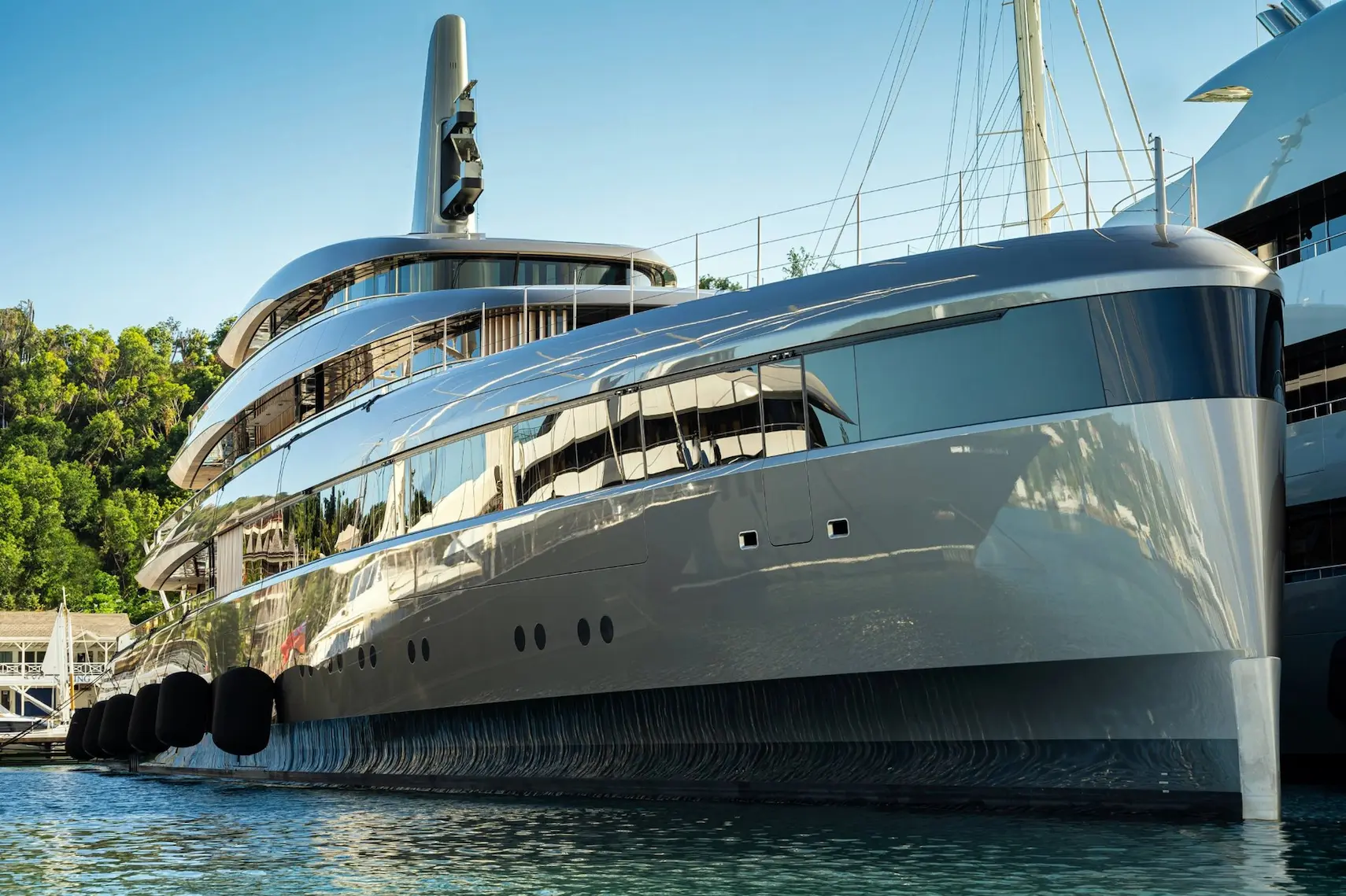 Close-up of an ultra-luxury superyacht docked in the Mediterranean, symbolizing elite private chef recruitment services by Montclair Chef