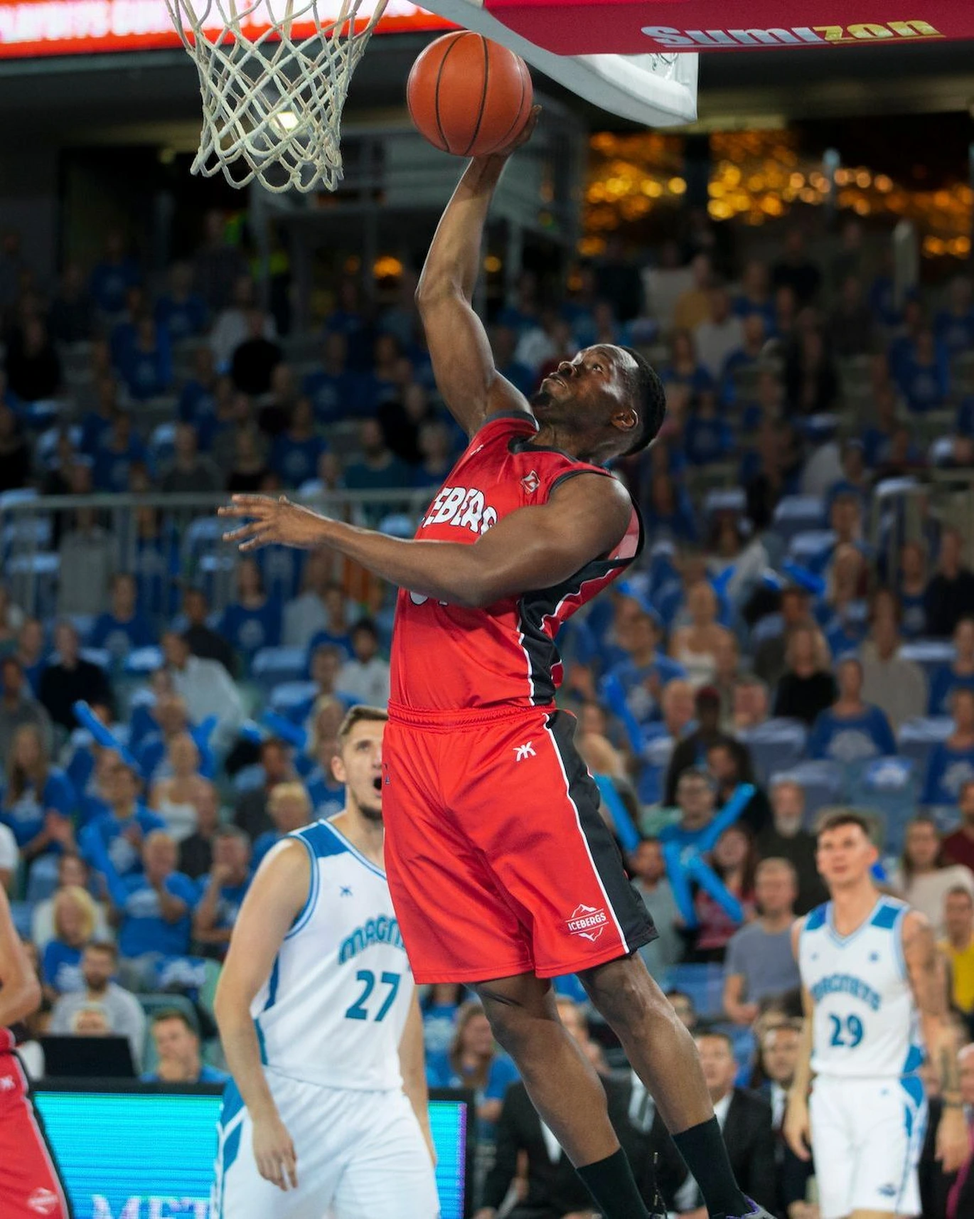 Professional basketball player performing a slam dunk during an NBA game, representing Montclair Chef’s private chef services for elite athletes.