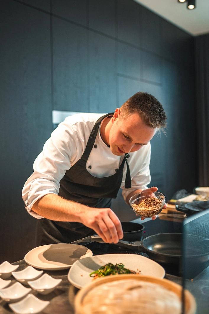 A nutrition expert plating food for an athlete