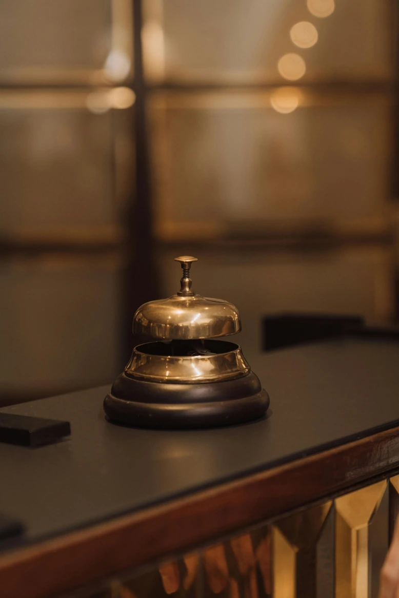 Luxury service bell symbolizing discretion, reliability, and trust in private staffing