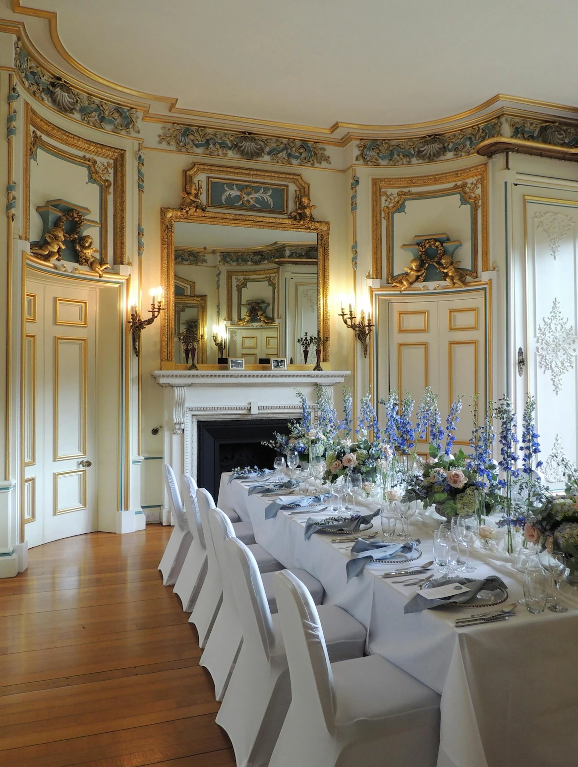 Historic estate dining room set for formal kosher dinner party with gold leaf details, crystal glasses, and elaborate floral arrangements - Manhattan Orthodox family entertainment by Montclair Chef