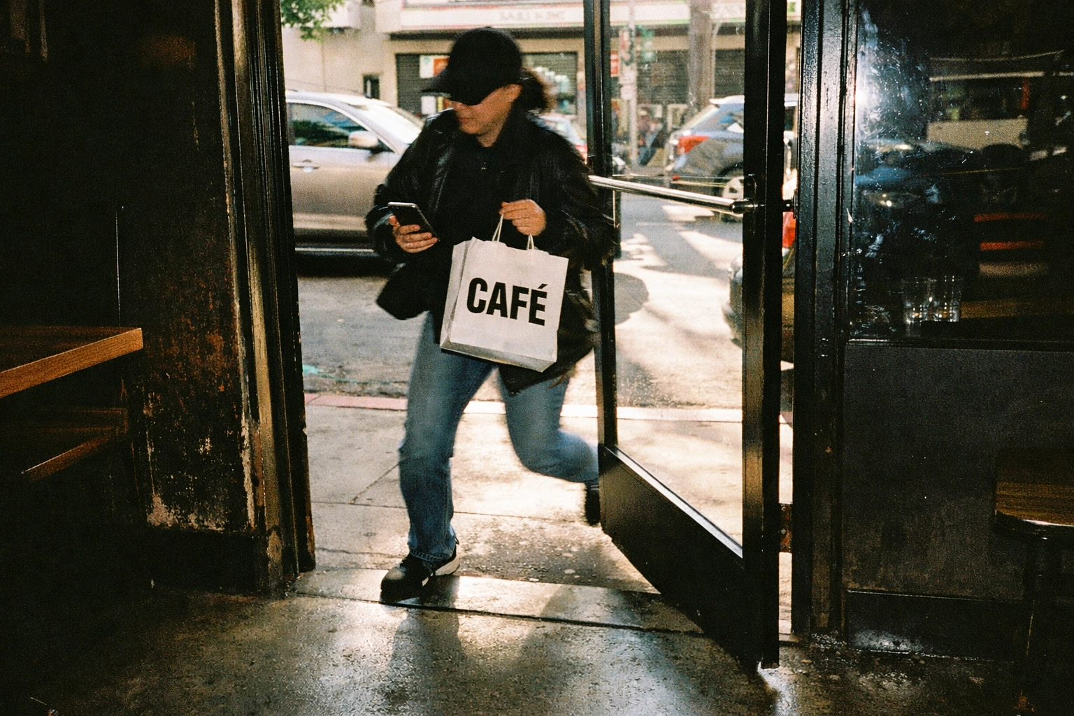 Customer leaving restaurant with click & collect takeaway order