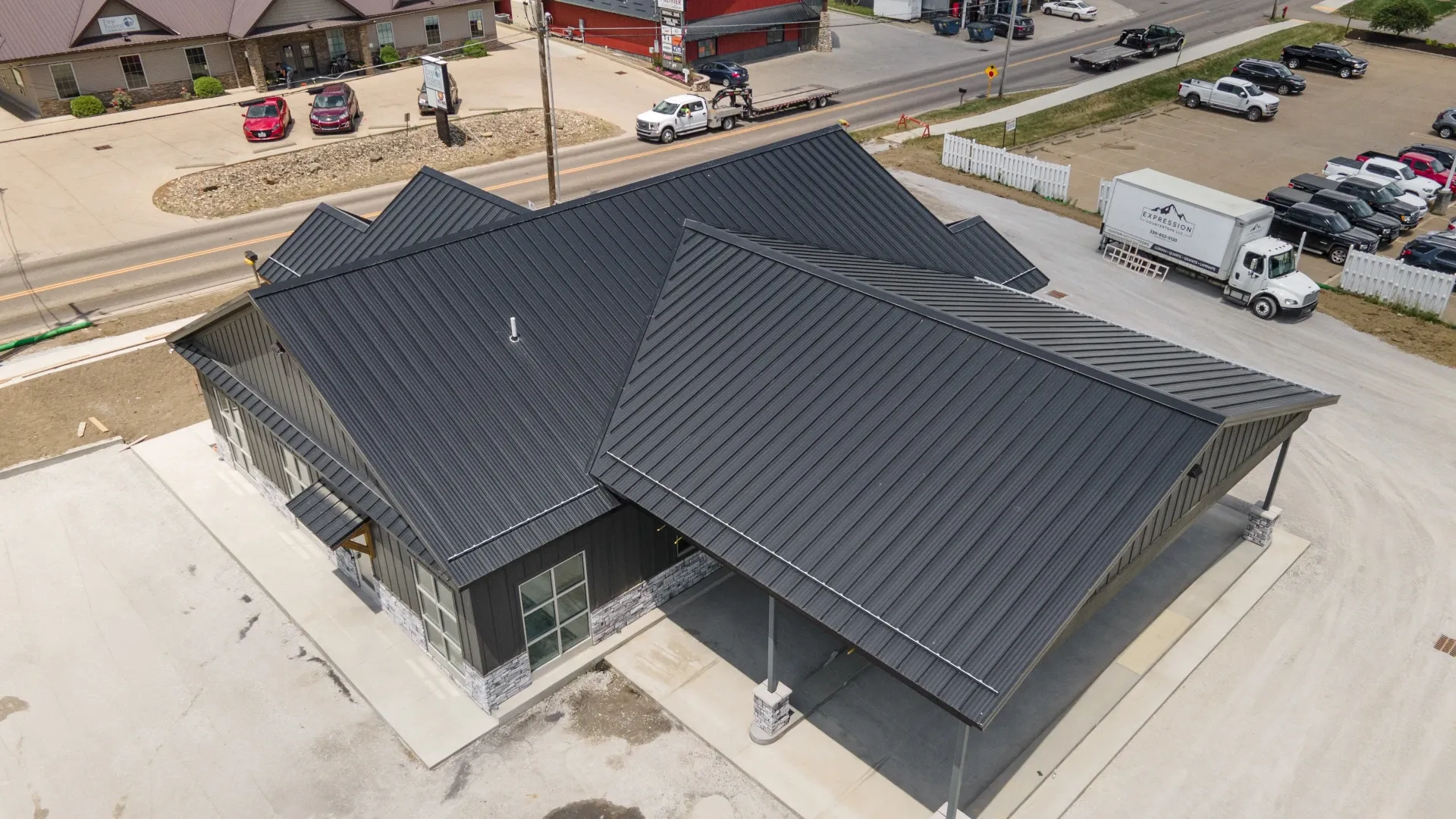 aerial view of black standing seam metal roof on a black building