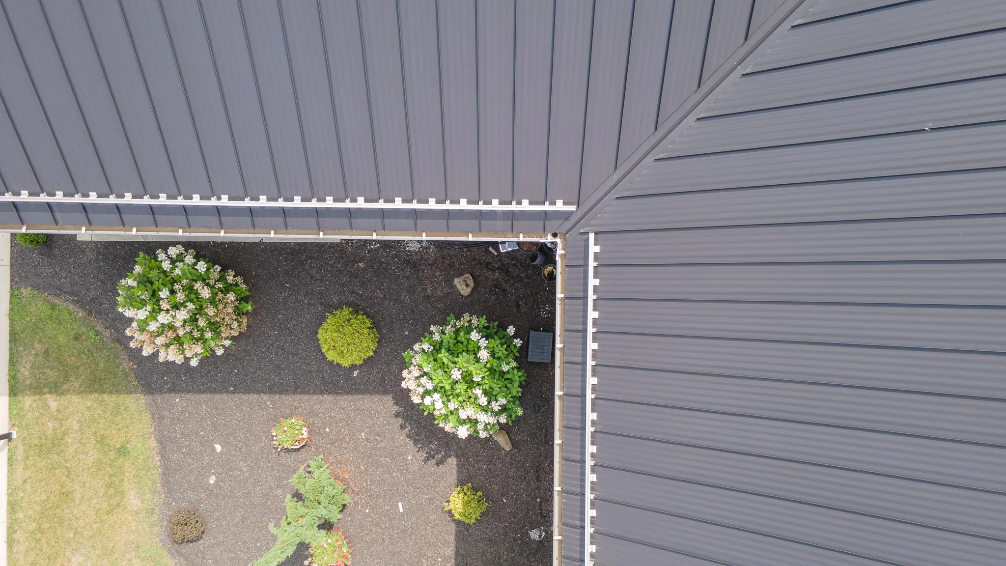 black metal roof with gutters and snow guards