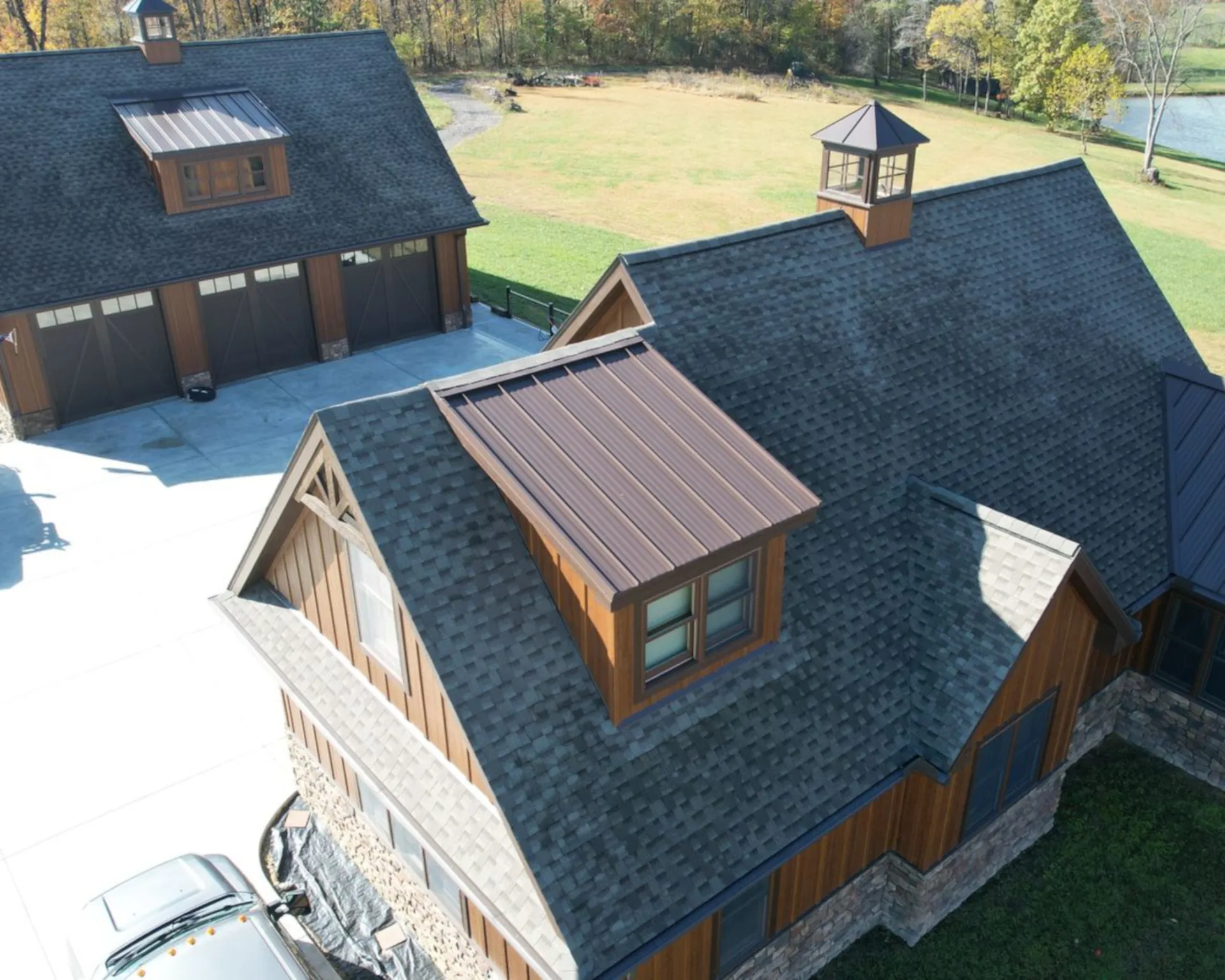 brown house with black shingle roofing