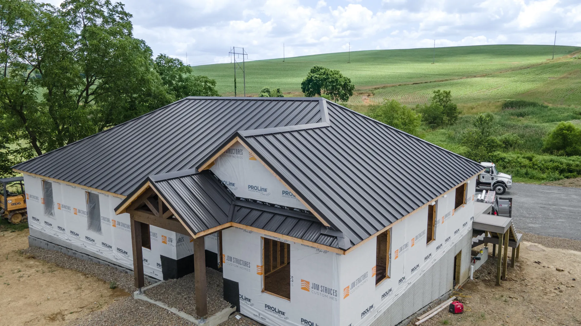 black standing seam metal roof on a new house