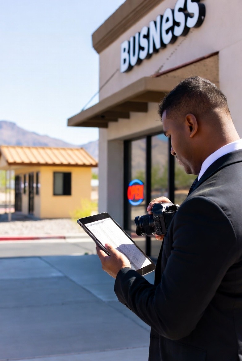 Lake Mead Mobile Notary field inspector documenting small business storefront in Las Vegas Nevada
