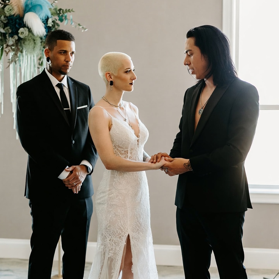 las vegas wedding officiant leading an alternative body positive wedding ceremony for a couple in a private indoor setting
