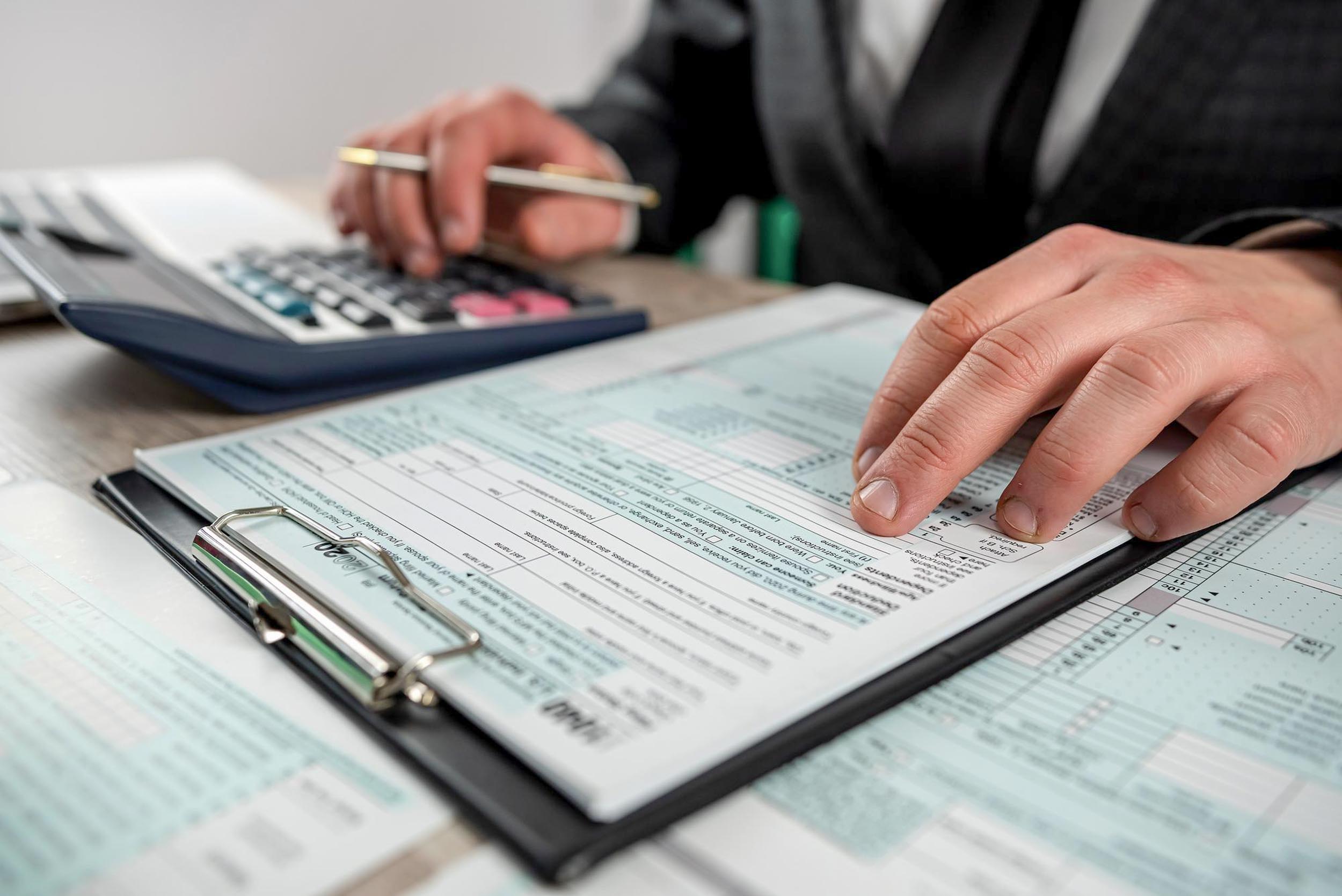 Man filling out tax return