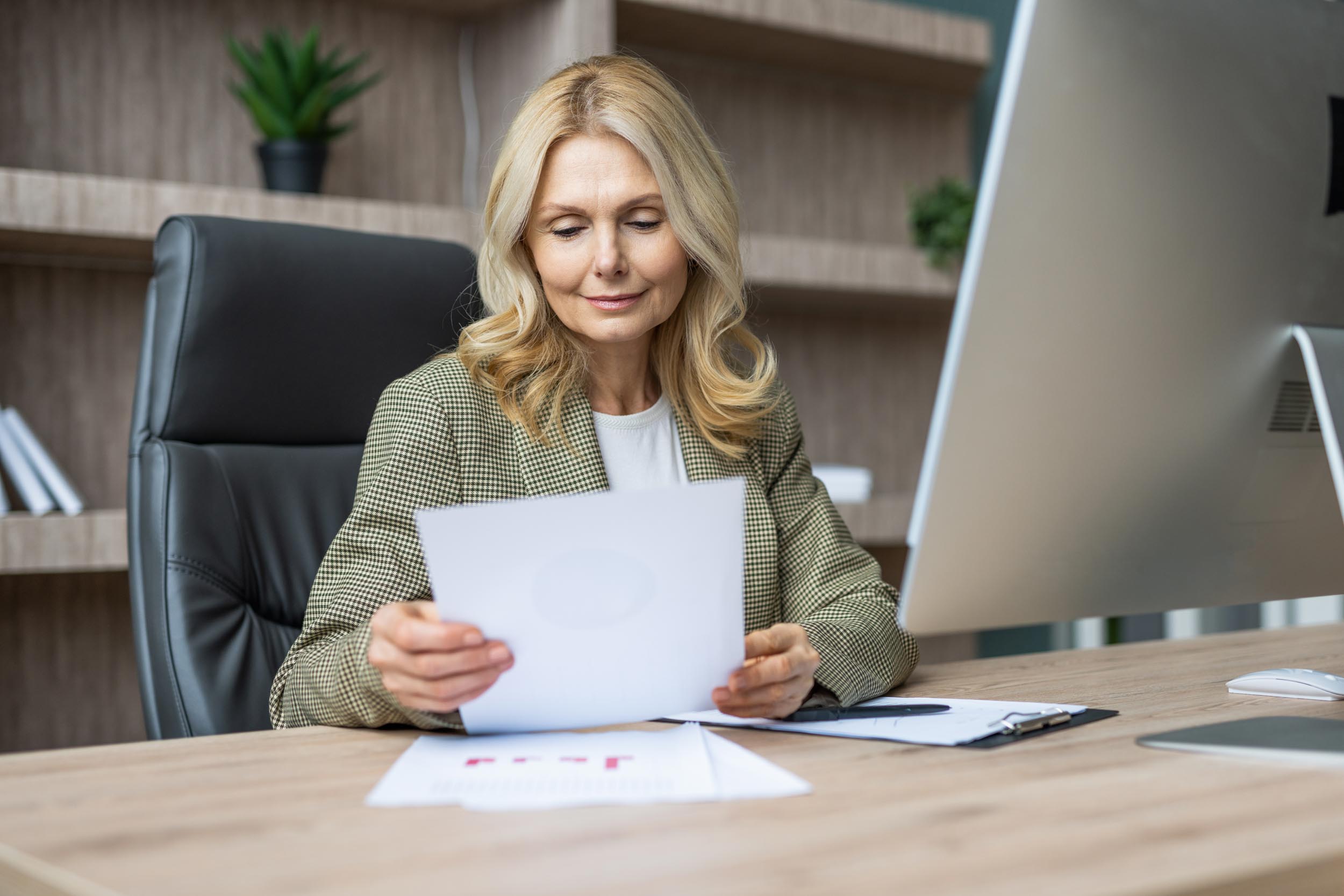 Woman working at desk.