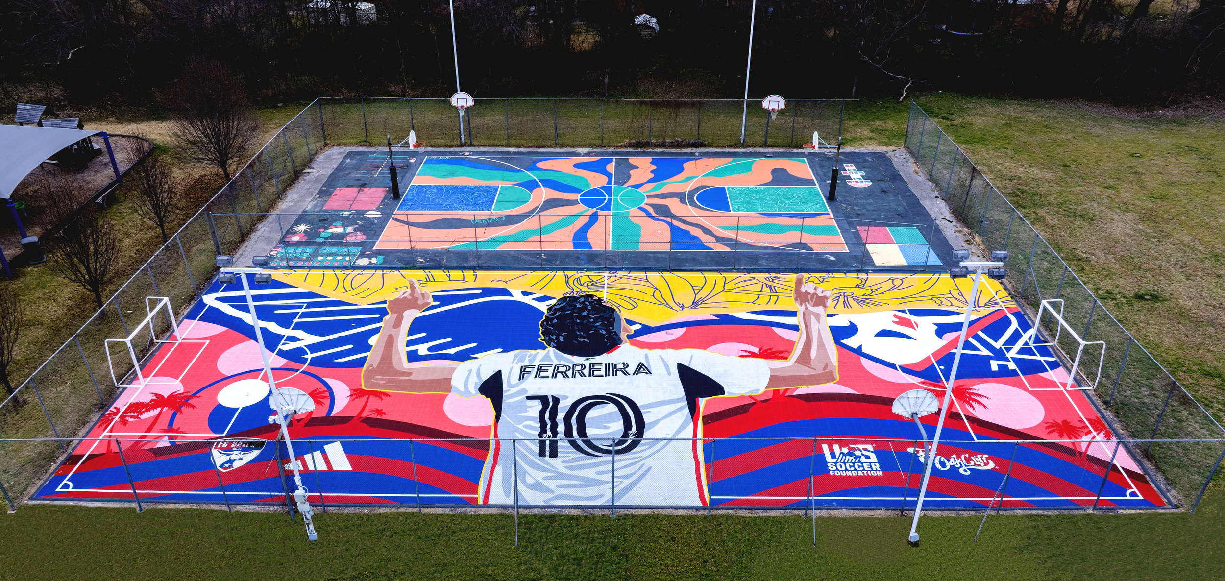 Colorful outdoor sports courts with a mural of a soccer player wearing a jersey labeled 'Ferreira 10' with raised arms on the foreground court.
