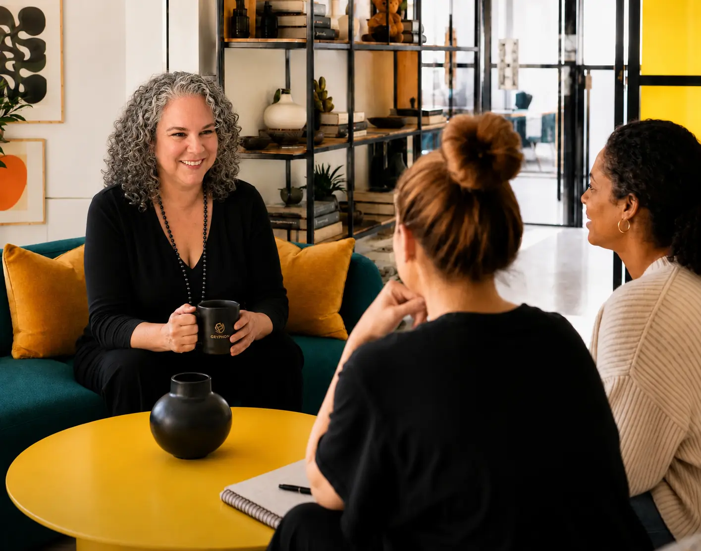 Michele Slobin meeting with clients during a collaborative strategy session. Represents Gryphon Design Strategy's women-led perspective, collaborative leadership, and strategic partnership approach.