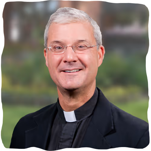 Headshot of Fr. John Riley.
