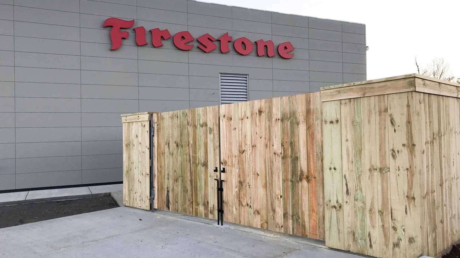 Dumpster fencing for commercial business by LC Fence.