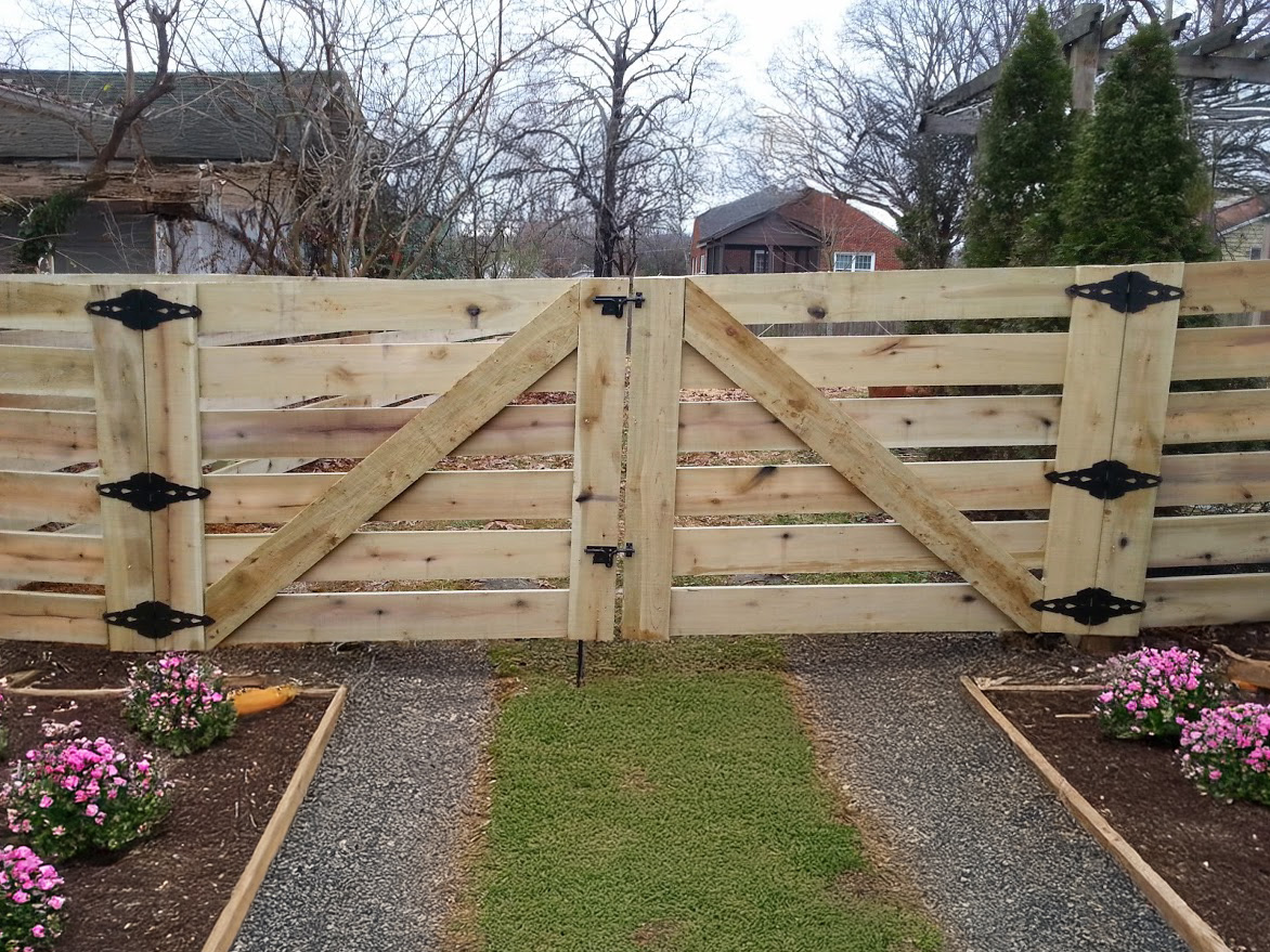 Six board horse fence on acreage in East Tennessee