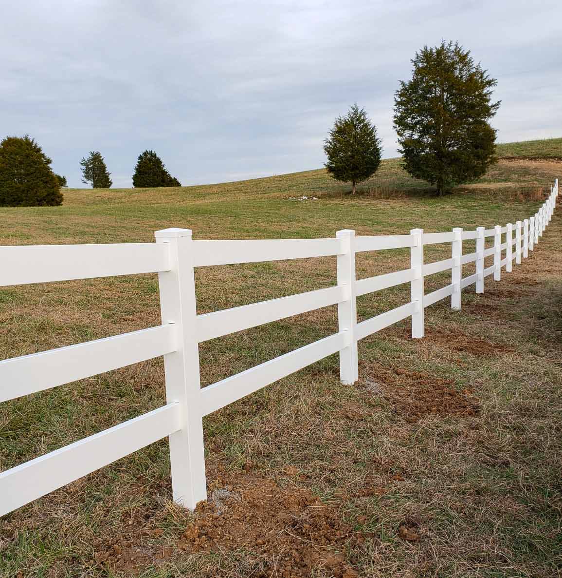 Vinyl farm fence on open ground in East Tennessee