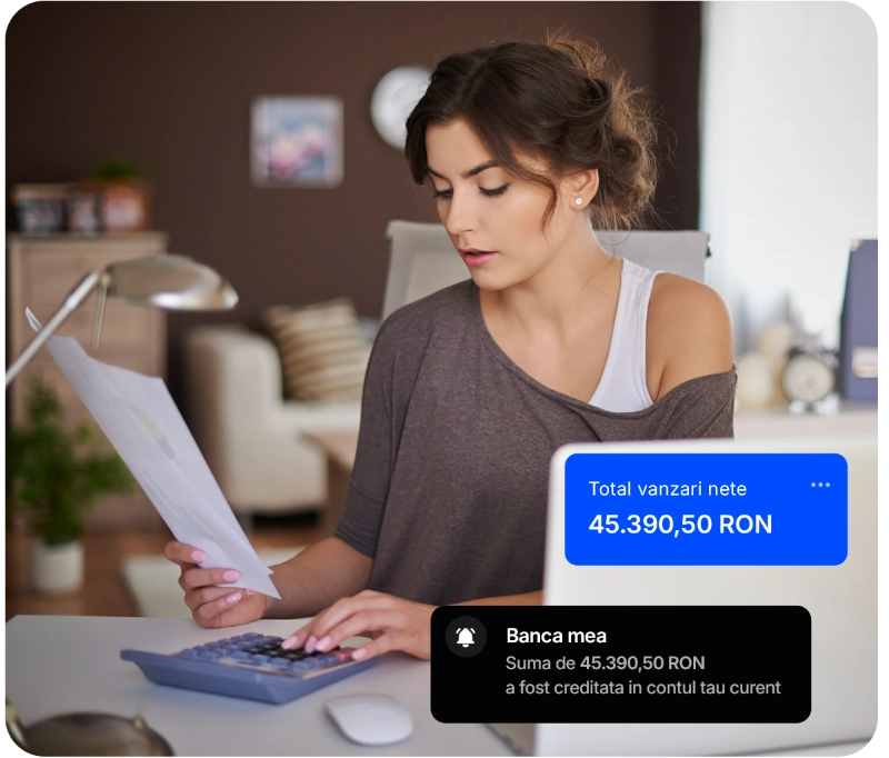 O femeie sta la birou intr-o camera primitoare, concentrata pe documente. Un calculator si notificari arata 45.390,50 RON vanzari nete creditate in contul ei.