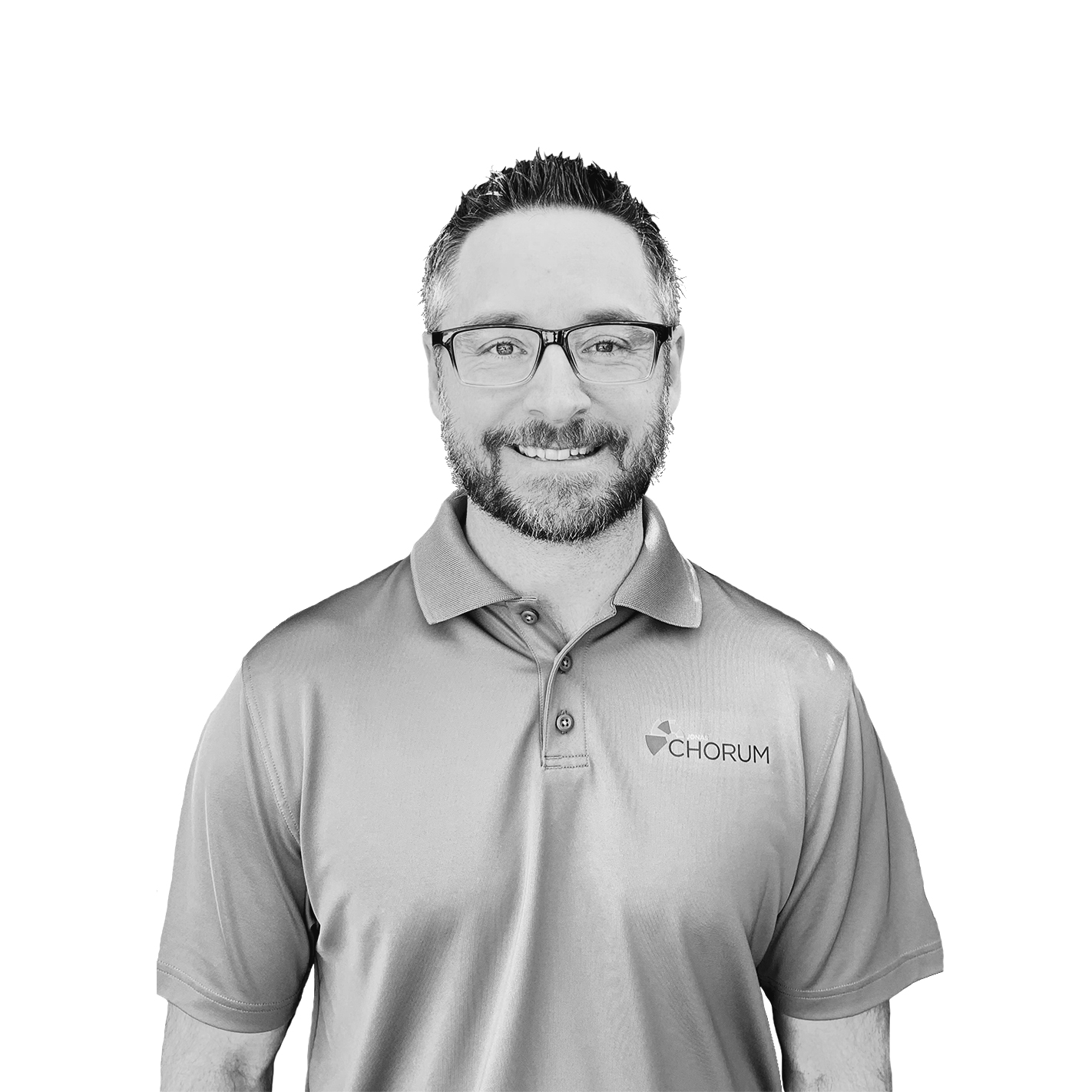 Smiling man with glasses and beard wearing a Chorum-branded polo shirt.