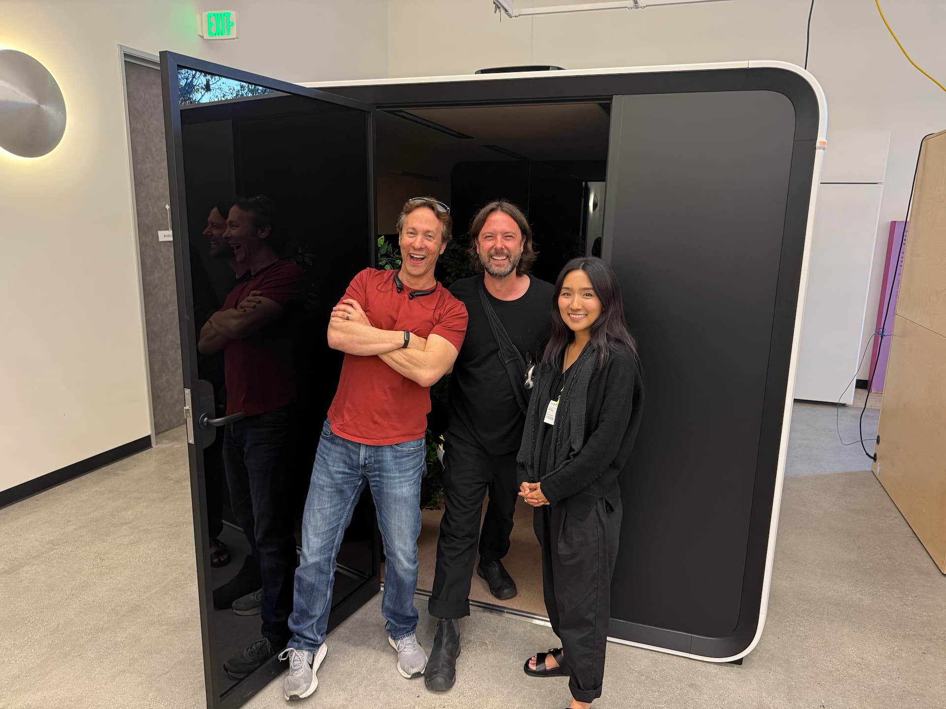 Dr. David Eagleman, Jacob Marshall, and Hae-jin Marshall stand outside an Applied Wonder pod.