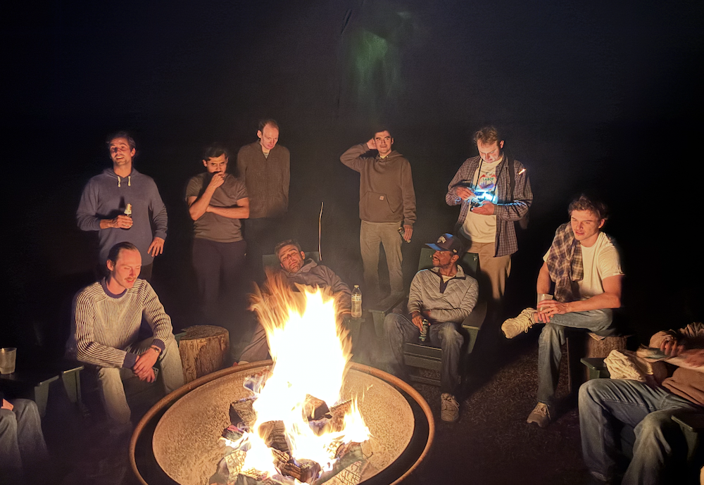 Ekho team around the campfire at the offsite