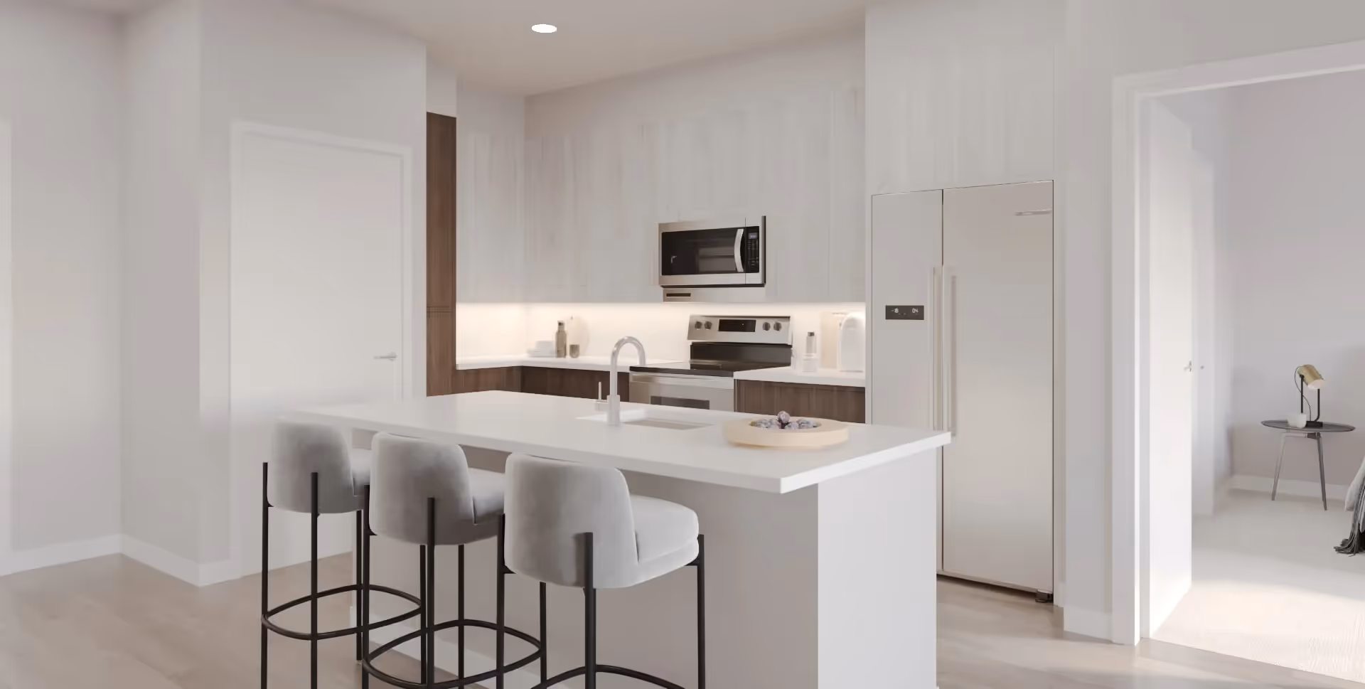 Modern kitchen with a white island, white cabinets, and stainless steel appliances, showing a contemporary home at Trails at Big Spring in Big Spring, TX.