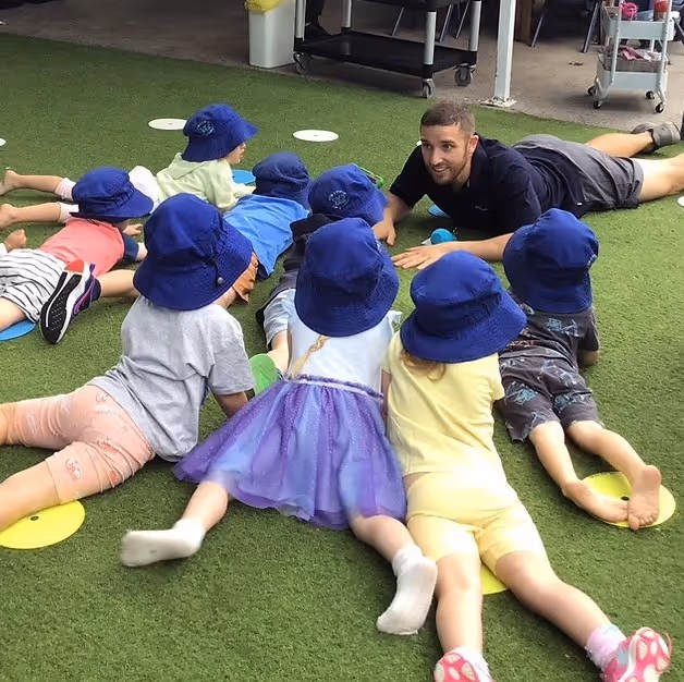 Kids gathering around the coach