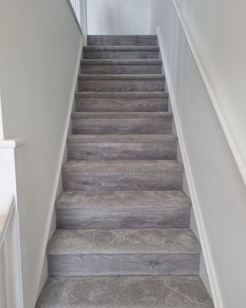 staircase with carpet