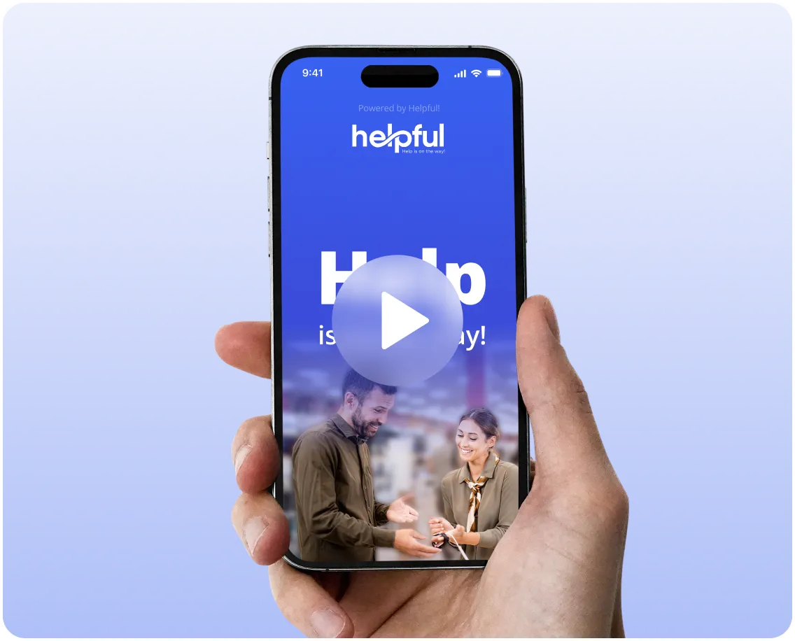 Hand holding a smartphone displaying the Helpful app interface with a man and woman smiling and a play button overlay.