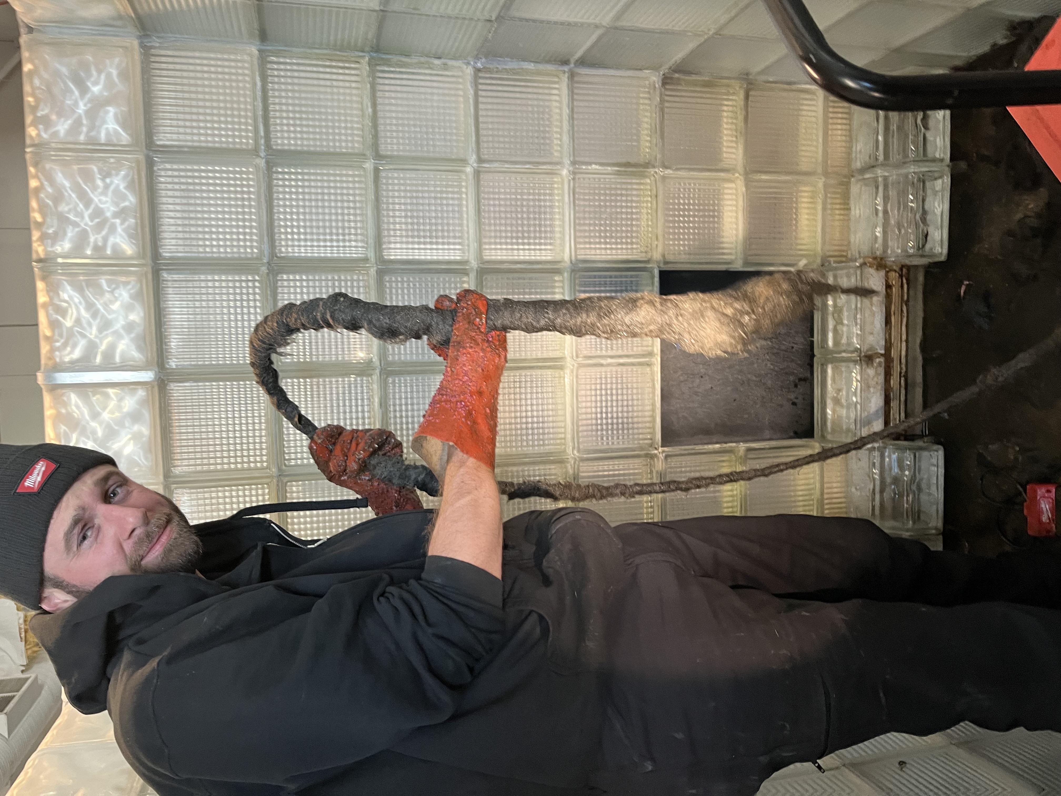 plumber cleaning a drain