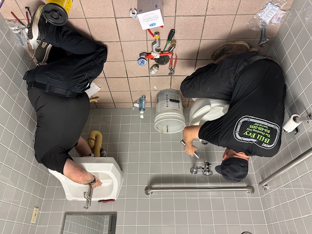 emergency plumbers working on drains