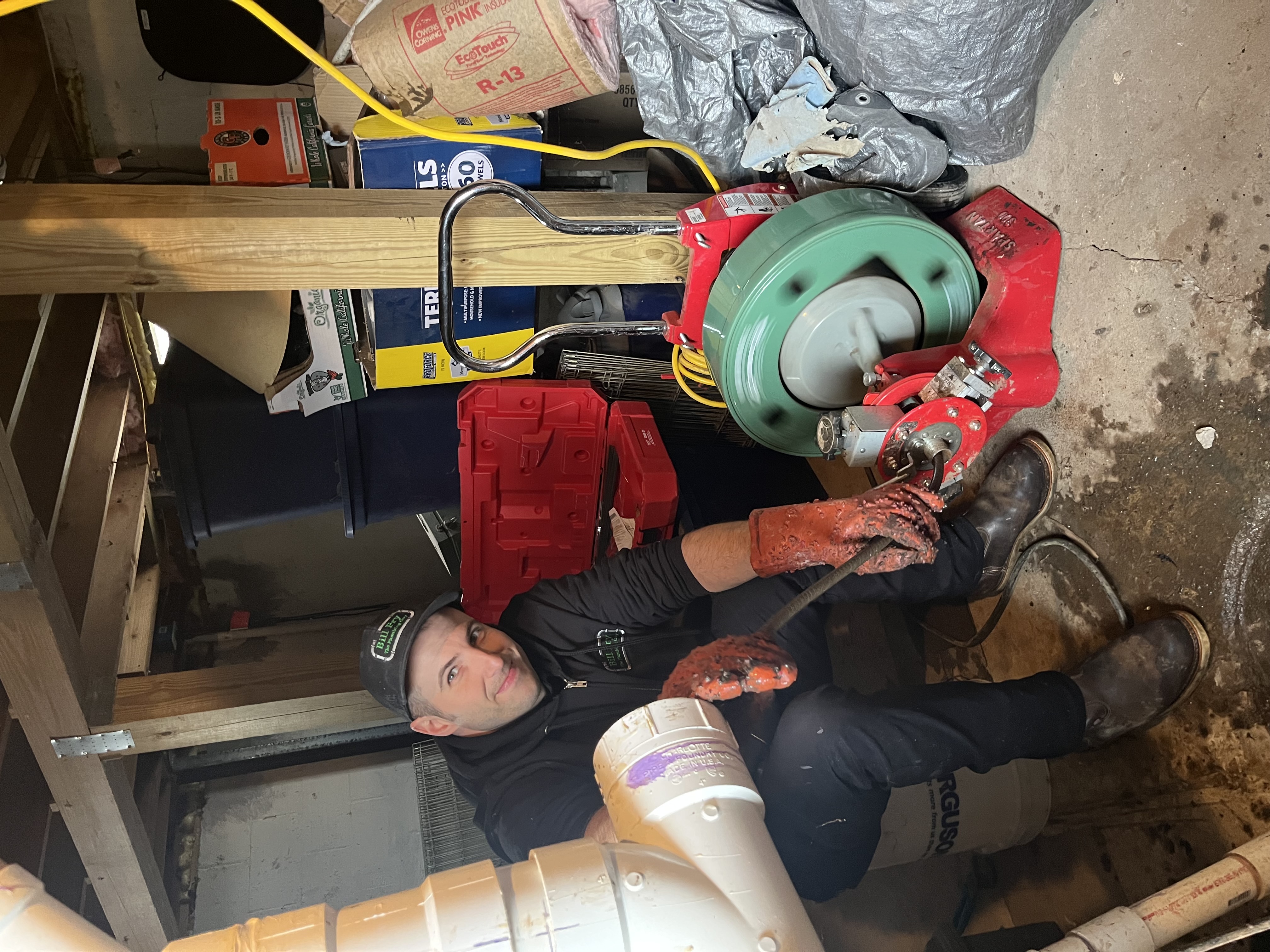 plumber cleaning a drain