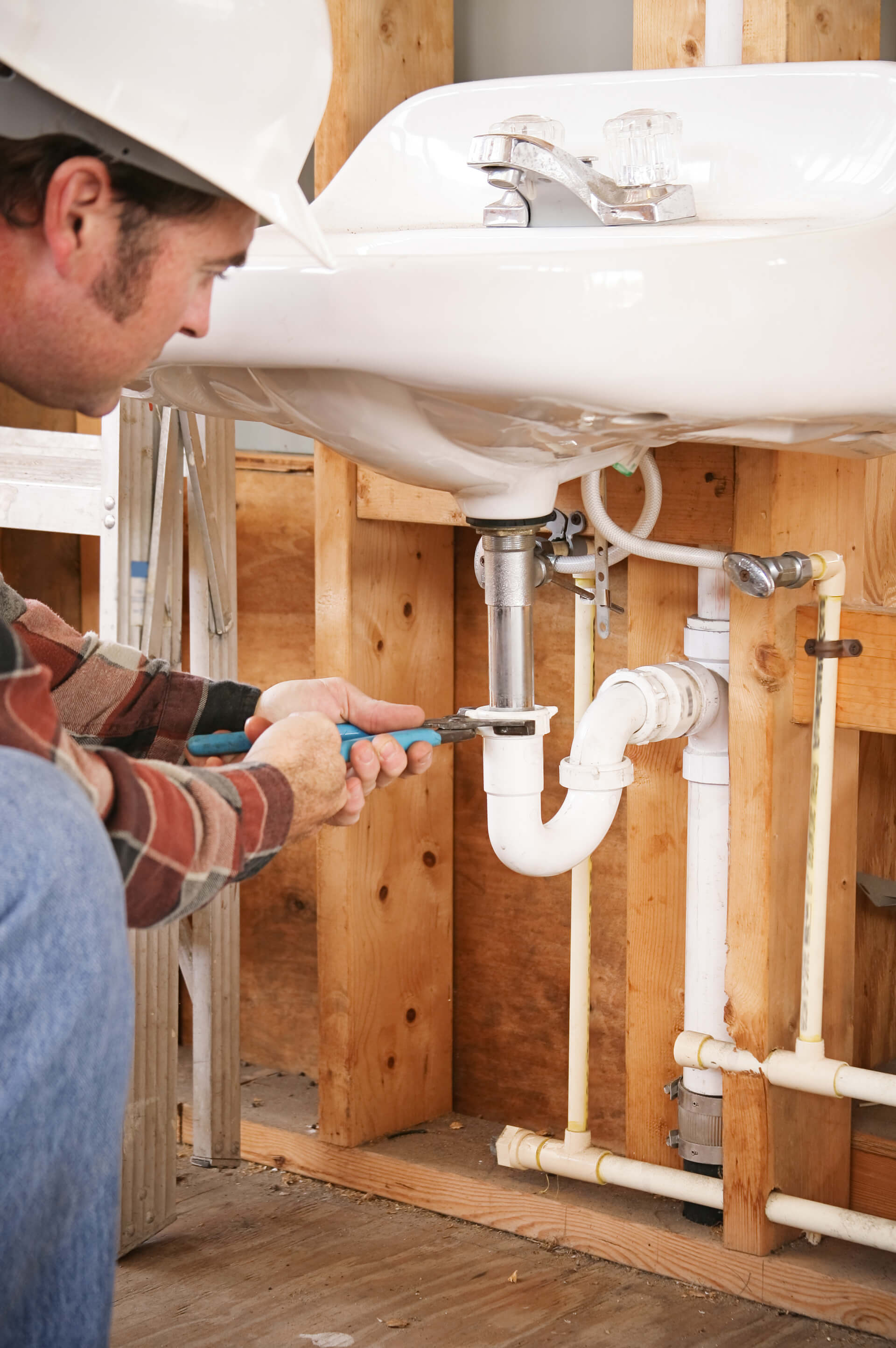 plumber fixing a sink