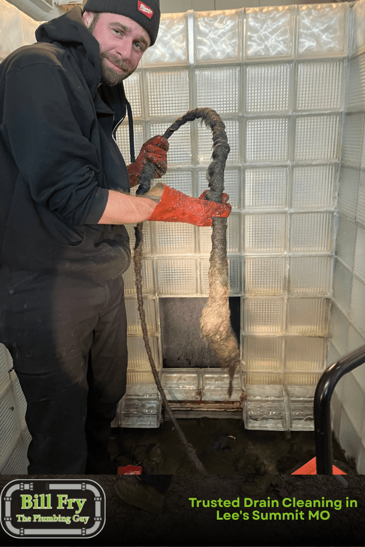 plumber cleaning a drain
