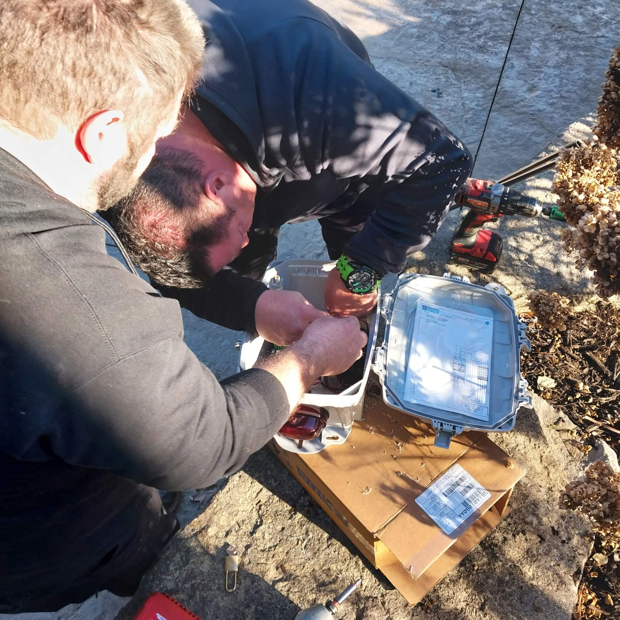 plumbers inspecting a drain